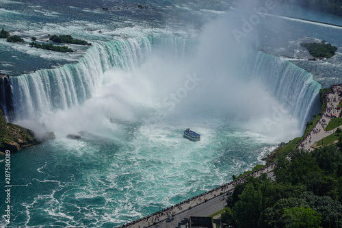 Niagara Falls, Ontario, Canada: Aerial view of tourists watching as a tour boat approaches the Horseshoe Falls.