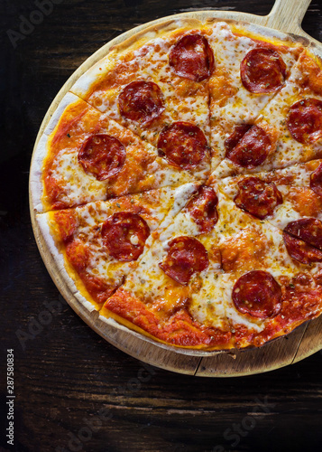 Close up top veiw of pepperoni pizza.