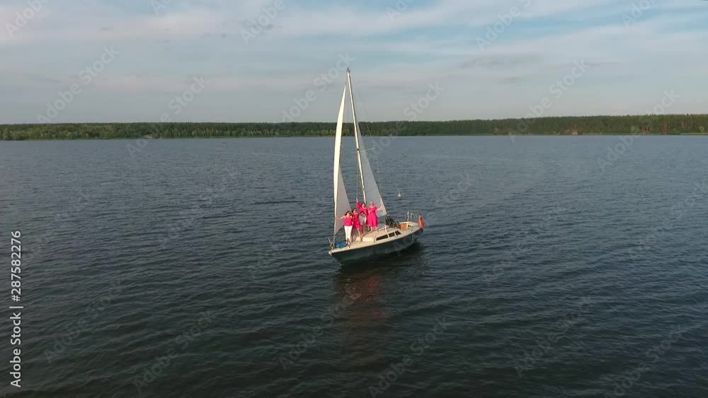 Group of tourists having party on sailing boat Group of tourists having party on sailing boat