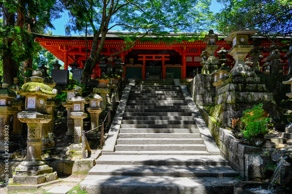 Ancient stone lanterns in Nara park, Japan Ancient stone lanterns in Nara park, Japan