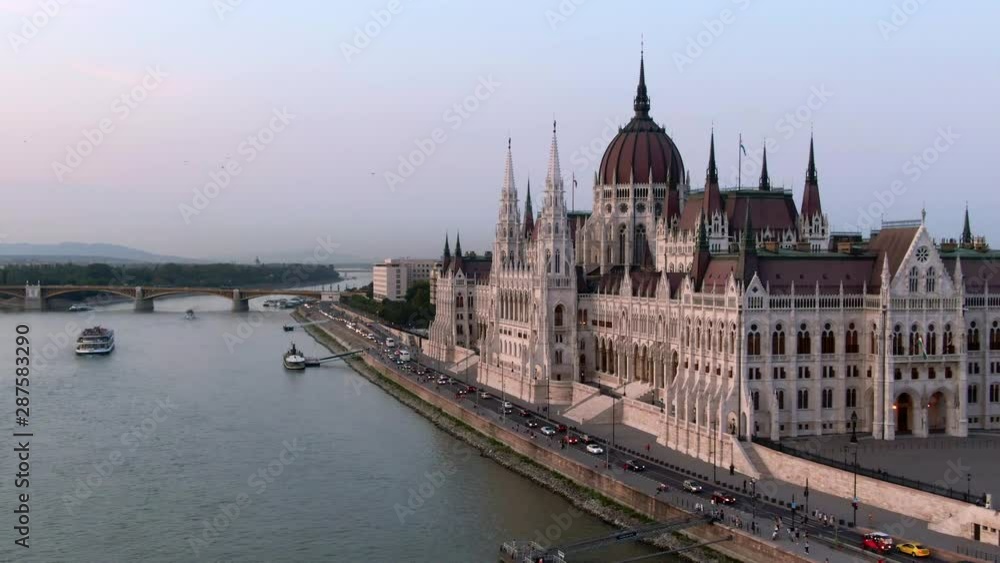 Budapest, Hungary, aerial view of the Hungarian Parliament Building and Danube river at dusk. Budapest, Hungary, aerial view of the Hungarian Parliament Building and Danube river at dusk.