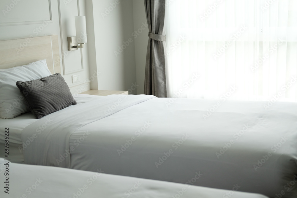 Fototapeta premium bed in in hotel resort. bedroom interior