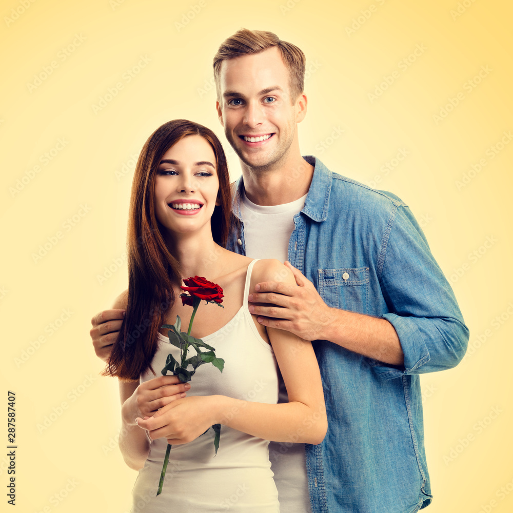 Square composition picture of hugging couple with rose Square composition picture of hugging couple with rose