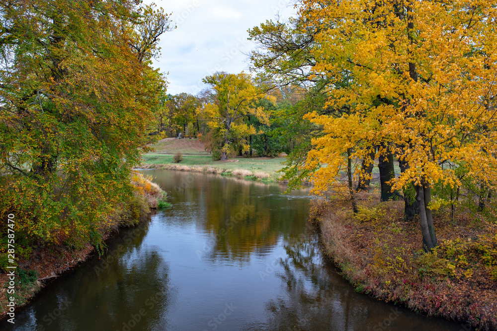 Muskau Park and Neisse river at autumn morning. German-Polish border Muskau Park and Neisse river at autumn morning. German-Polish border
