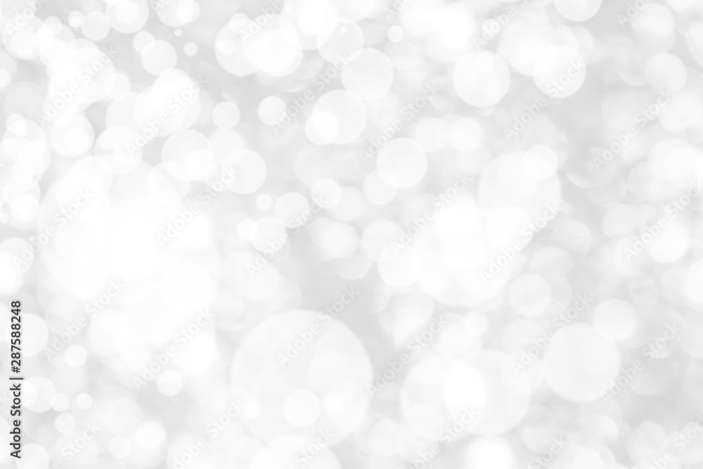 Abstract background with White bokeh on gray background. christmas blurred beautiful shiny Christmas lights. Abstract background with White bokeh on gray background. christmas blurred beautiful shiny Christmas lights.