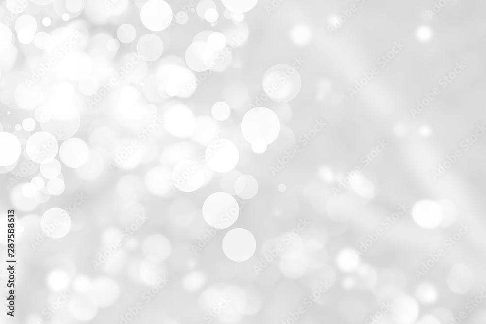 Abstract background with White bokeh on gray background. christmas blurred beautiful shiny Christmas lights. Abstract background with White bokeh on gray background. christmas blurred beautiful shiny Christmas lights.