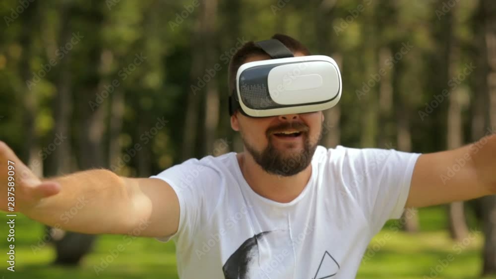 Young bearded man using a virtual reality headset Young bearded man using a virtual reality headset