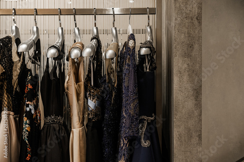 Photos Luxurious evening night out sparkling dresses hanging on the rack