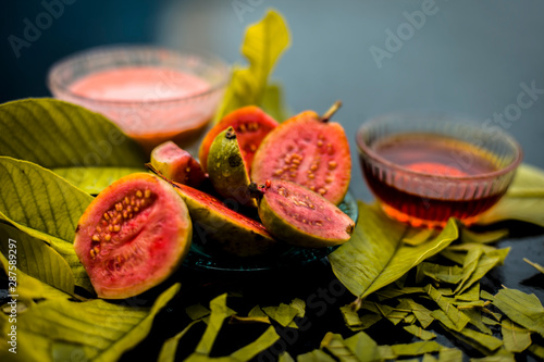 Skin whitening remedy/treatment on the black shiny surface consisting of guava pulp and honey. Also used in the spa as a face mask. photo