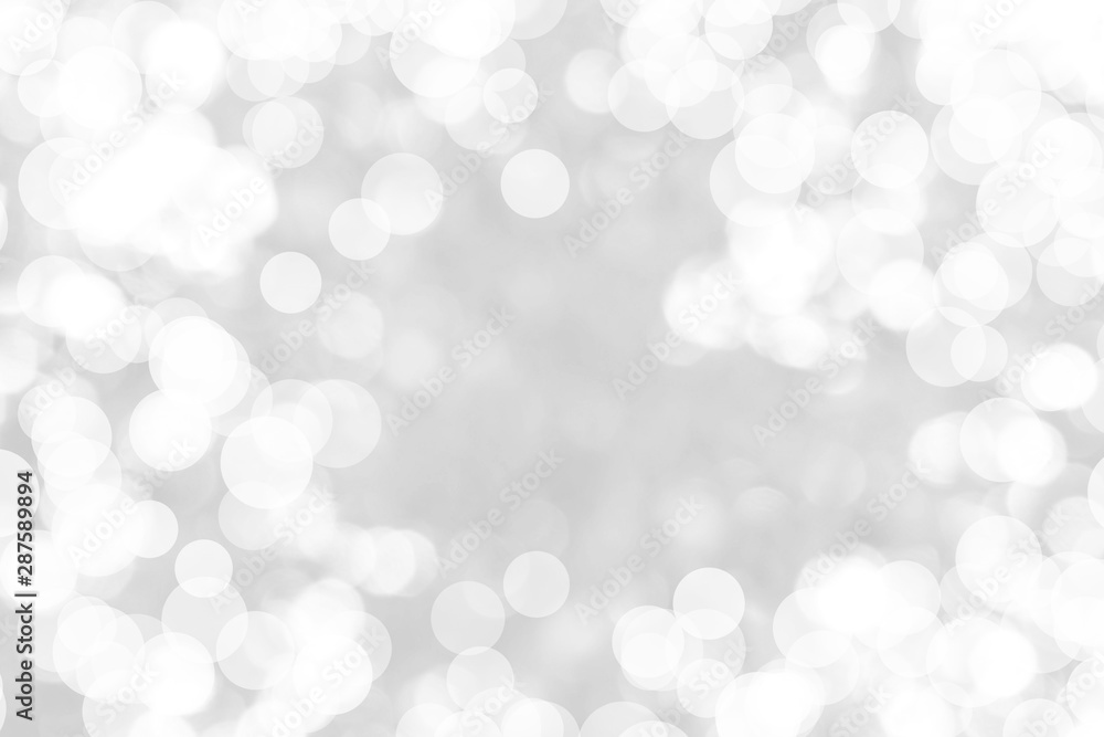 Abstract background with White bokeh on gray background. christmas blurred beautiful shiny Christmas lights. Abstract background with White bokeh on gray background. christmas blurred beautiful shiny Christmas lights.