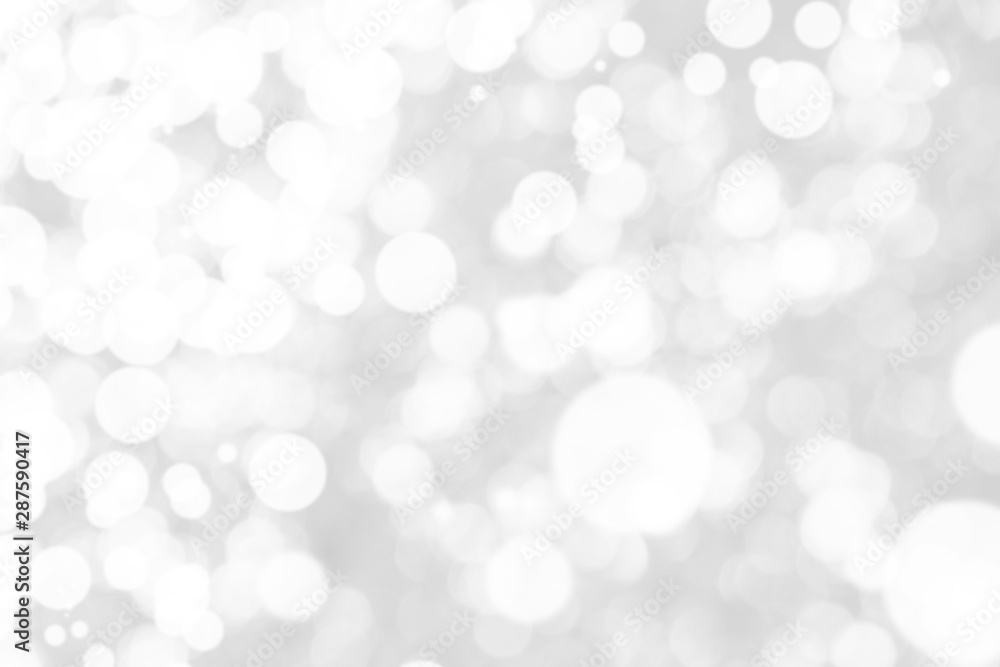 Abstract background with White bokeh on gray background. christmas blurred beautiful shiny Christmas lights. Abstract background with White bokeh on gray background. christmas blurred beautiful shiny Christmas lights.