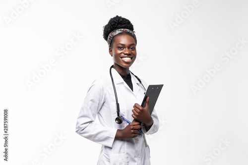 Portrait of happy african medical intern doctor writing on clipboard isolated on white background photo
