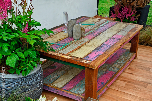 Принти на полотні A large coffee table stained and made from reclaimed timber with accessories on