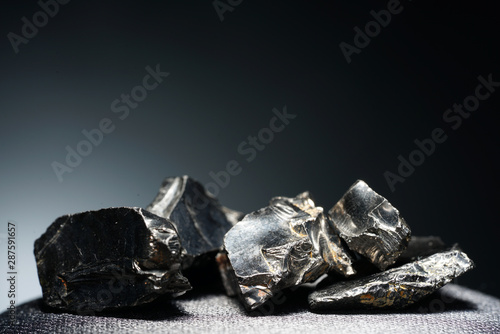 A black rock also called healing stone shungite, which consists mainly of carbon was photographed here in top quality.