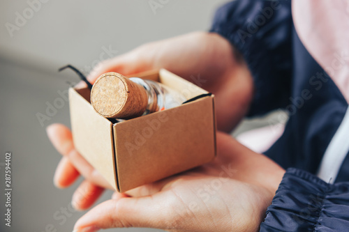 Present with wine cork in craft box photo