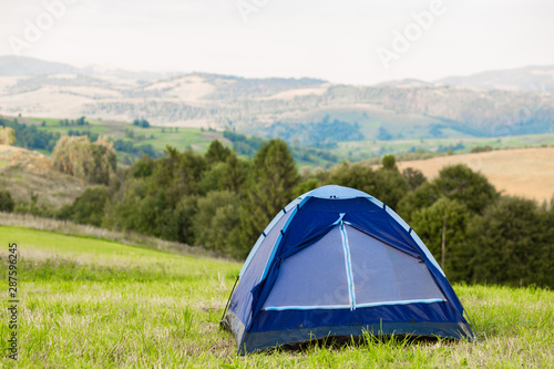 Morning landscape with beautiful view of mountains with tent. Camp on top of mountains