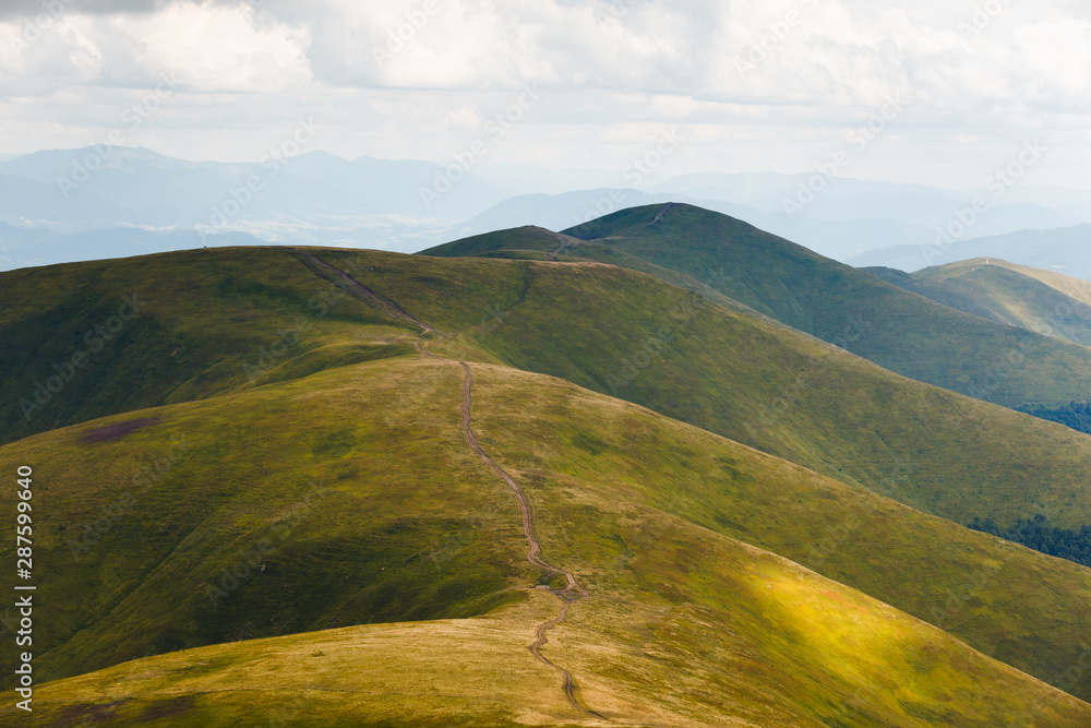Beautiful landscape of Borzhava ridge with a hiking trial of the Ukrainian Carpathian Mountains.