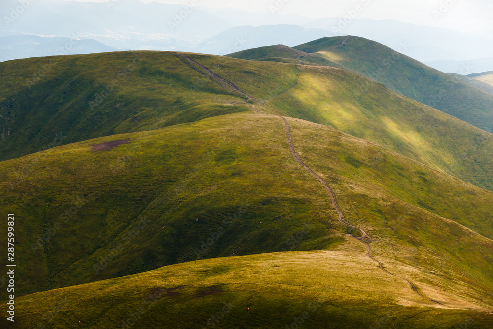 Landscape of hills covered with green grass. Location place Ukraine Carpathian mountains, Borzhava ridge.
