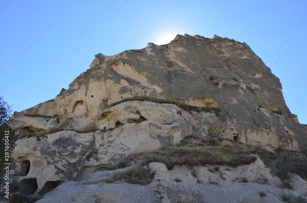 Beautiful fungous forms of sandstone in the canyon. Magic Cappadocia, Uchisar, Nevsehir Province in the Central Anatolia Region of Turkey, Asia. Beauty of nature. Concept background