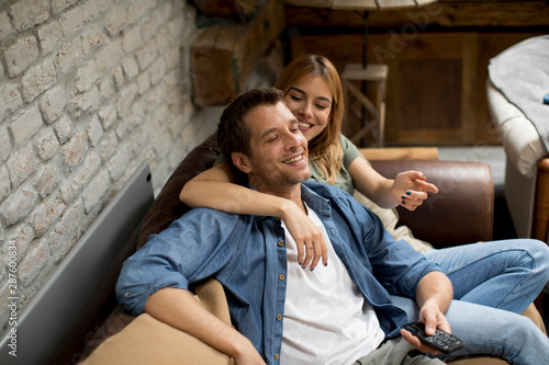 Smiling young couple relaxi...