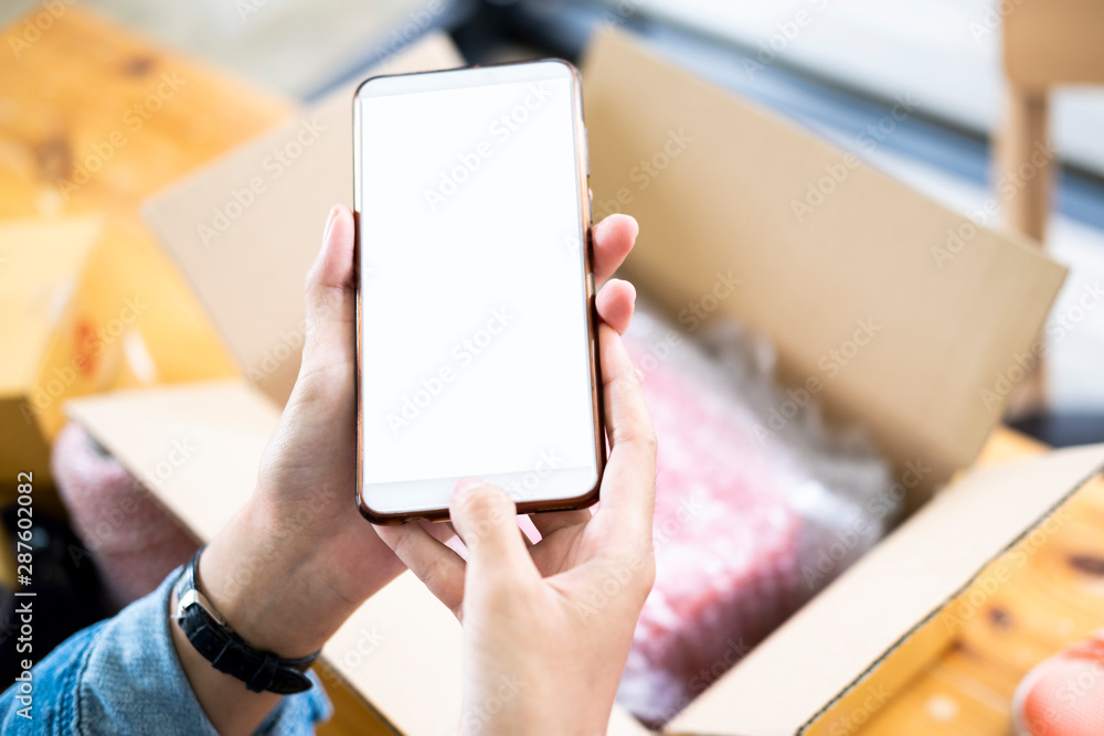 Online seller owner take a photo of product for upload to website online shop. Online seller owner take a photo of product for upload to website online shop.