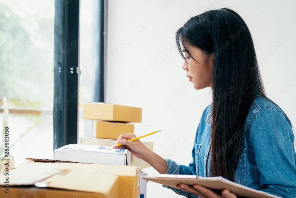 Online small business owner checking order. Online small business owner checking order.