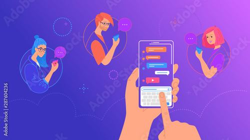 Human hand holds smart phone with messenger app and keyboard on screen