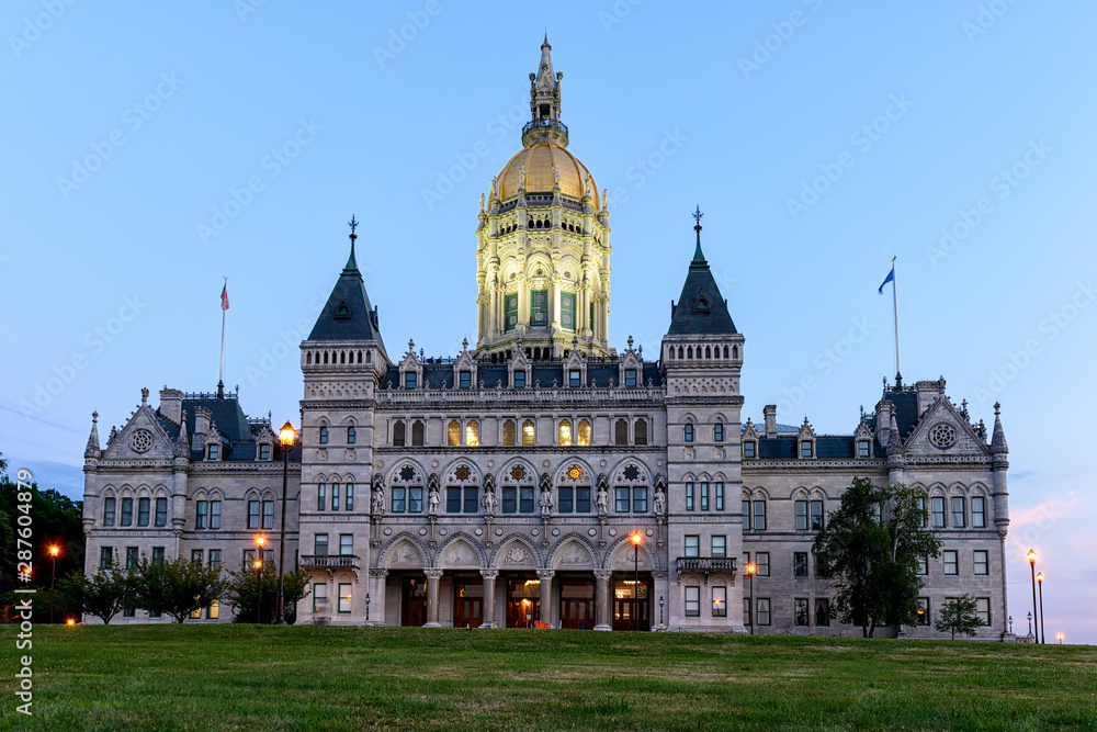 Naklejka premium Connecticut State Capitol Building with lights turned on after sunset
