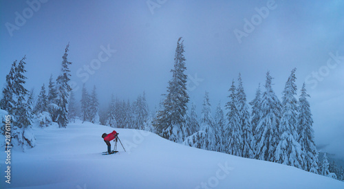 Photographer take a picture of winter landscape