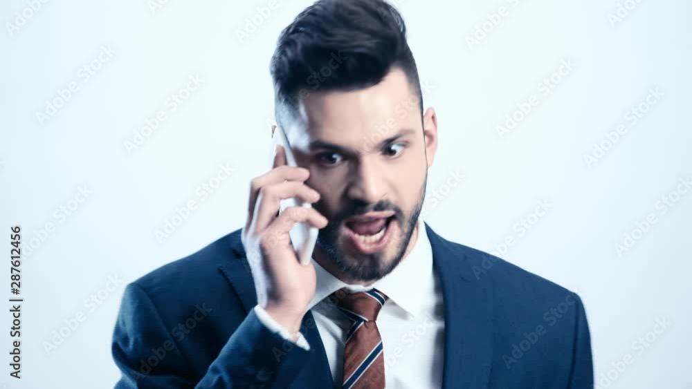 angry businessman talking on smartphone on white angry businessman talking on smartphone on white
