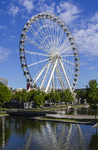 MONTREAL, CANADA June 25, 2018: La Grande Roue de Montreal is the tallest Ferris wheel in Canada. The Big Ferris Wheel in Old Harbour.