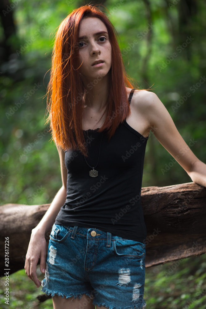 a skinny redhead girl in a brazilian forest a skinny redhead girl in a brazilian forest