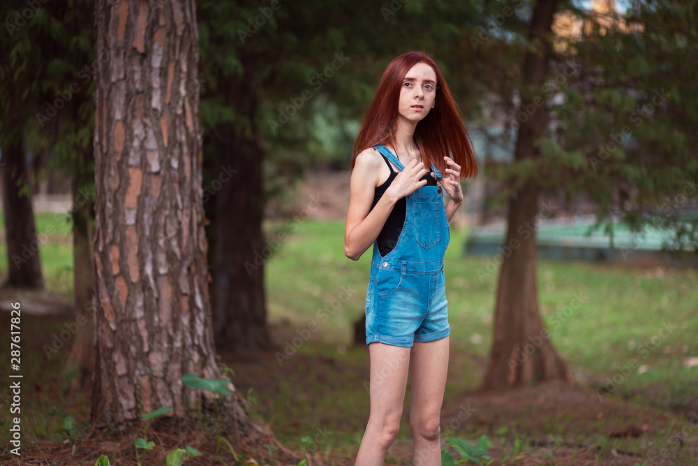 a skinny redhead girl in a brazilian forest a skinny redhead girl in a brazilian forest