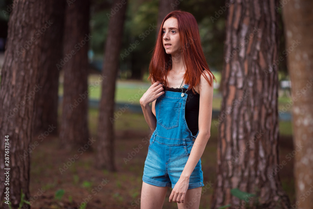 a skinny redhead girl in a brazilian forest a skinny redhead girl in a brazilian forest