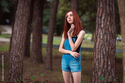 a skinny redhead girl in a brazilian forest © Vagner