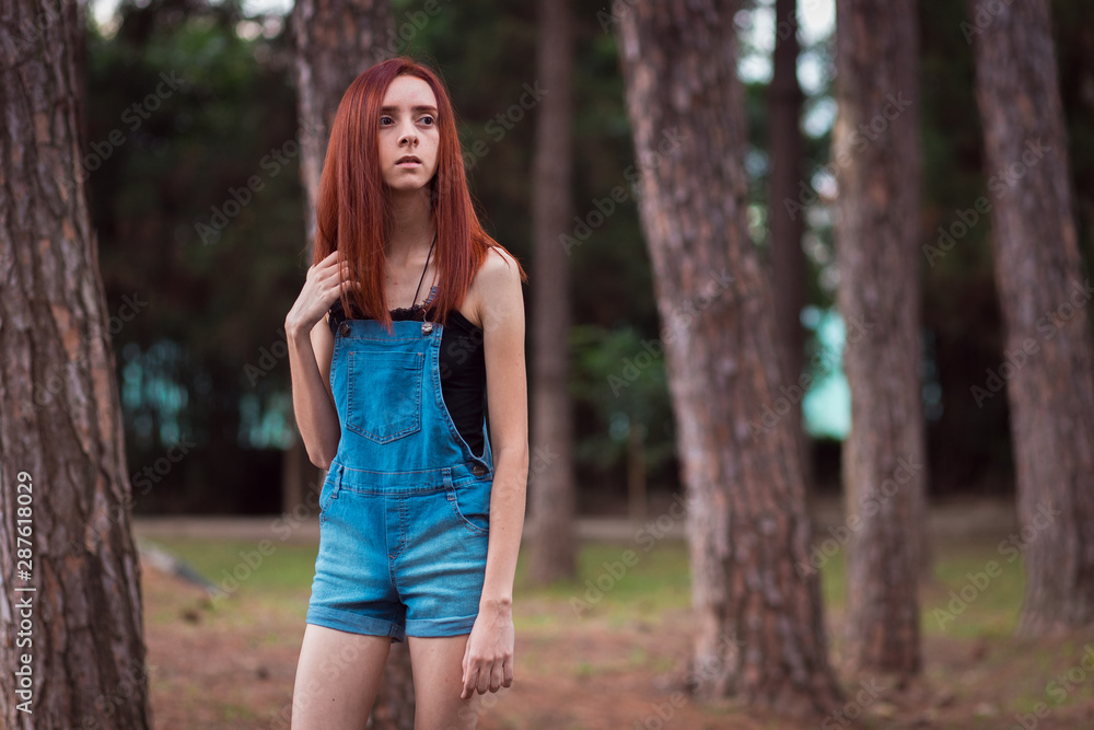 a skinny redhead girl in a brazilian forest a skinny redhead girl in a brazilian forest