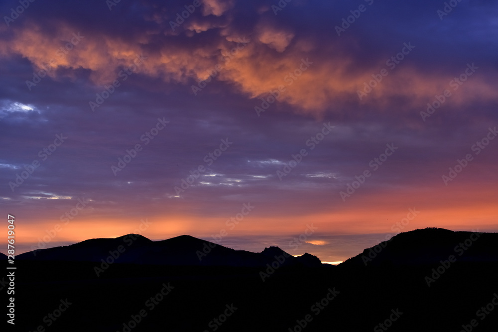 Summer sunset with blue and orange tones in a southern landscape