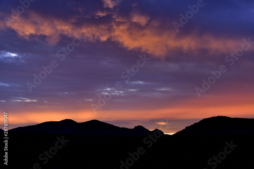 Summer sunset with blue and orange tones in a southern landscape