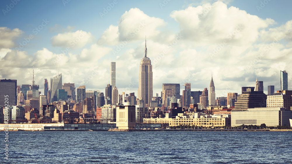 New York City waterfront skyline, retro color toning applied, USA.