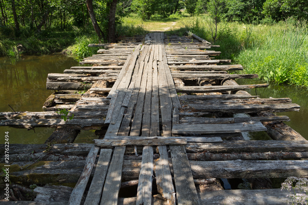 Fototapeta premium The destroyed wooden bridge.