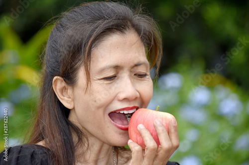 Female Senior And Happiness Eating An Apple © dtiberio