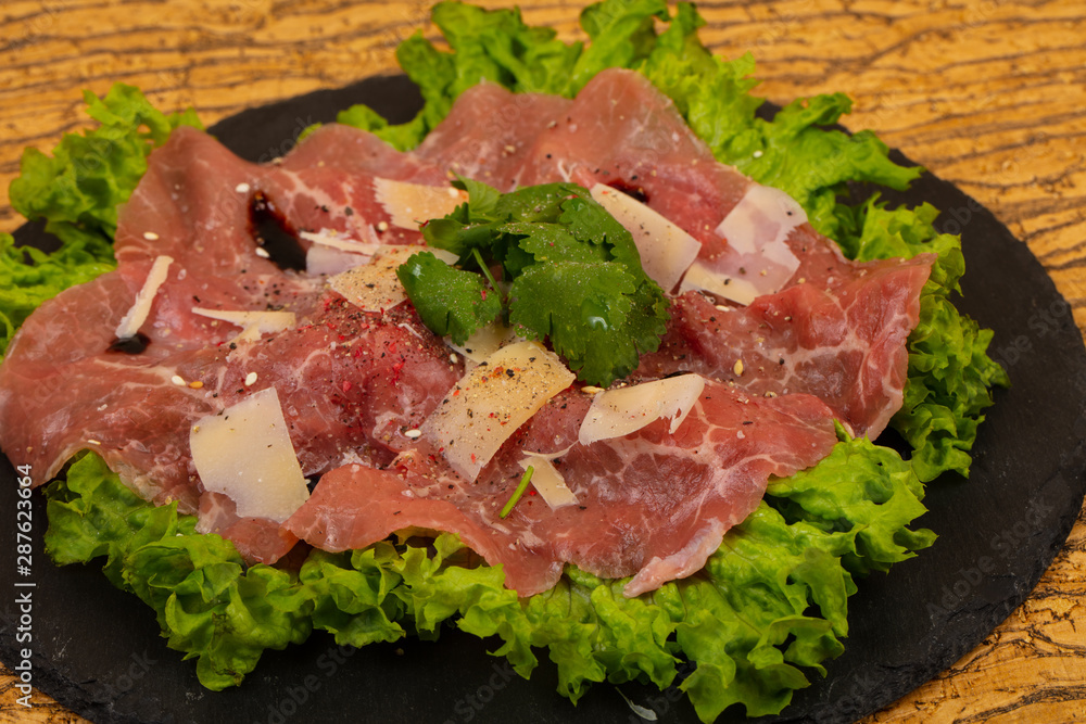 Beef carpaccio with parmesan cheese