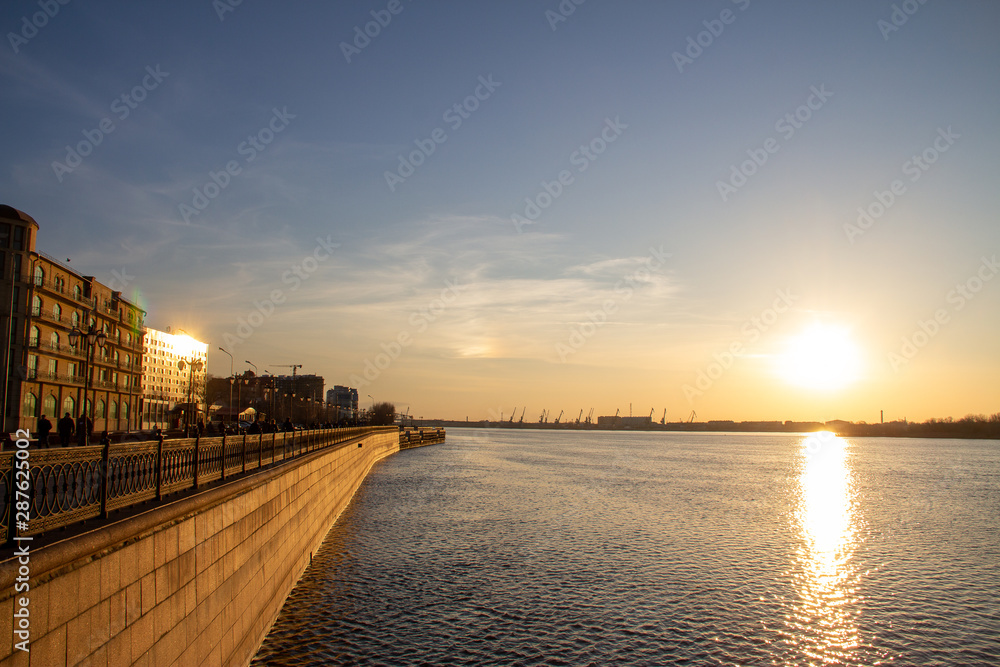 Bright sunset on the embankment of Astrakhan