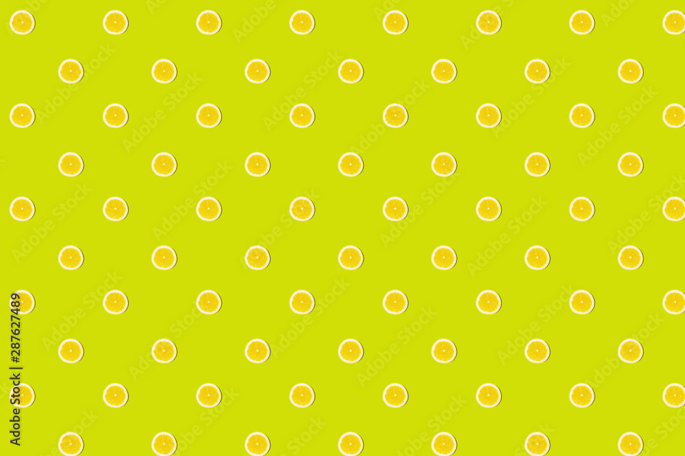 Seamless pattern of fresh lemon round cut on green Seamless pattern of fresh lemon round cut on green