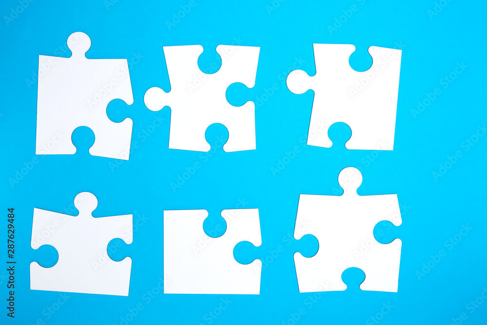 empty white big puzzles on a blue background empty white big puzzles on a blue background