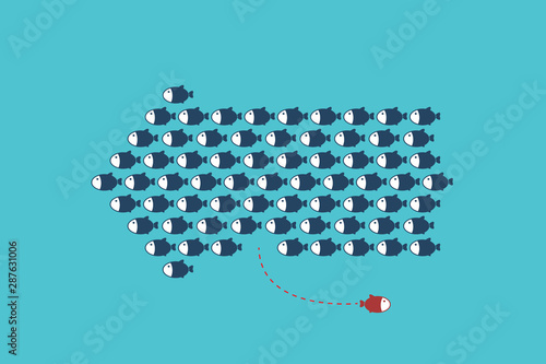 Think differently -One red unique different fish swimming opposite way of identical blue ones.
