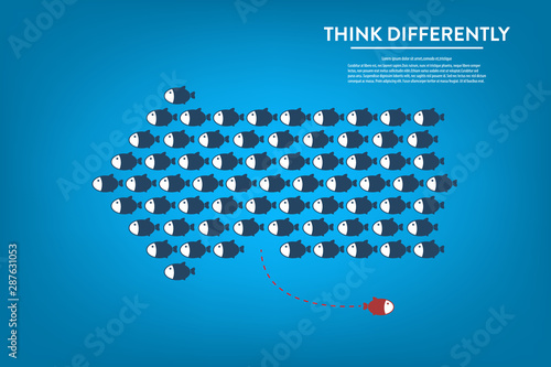 Think differently -One red unique different fish swimming opposite way of identical blue ones.