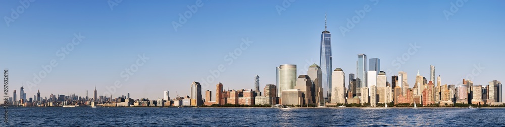 New York City skyline with cloudless sky just before the sunset, USA.