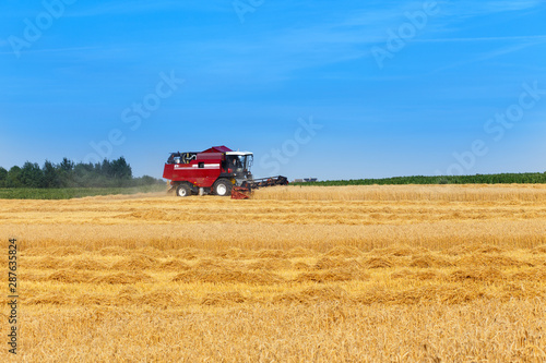 combine harvester working