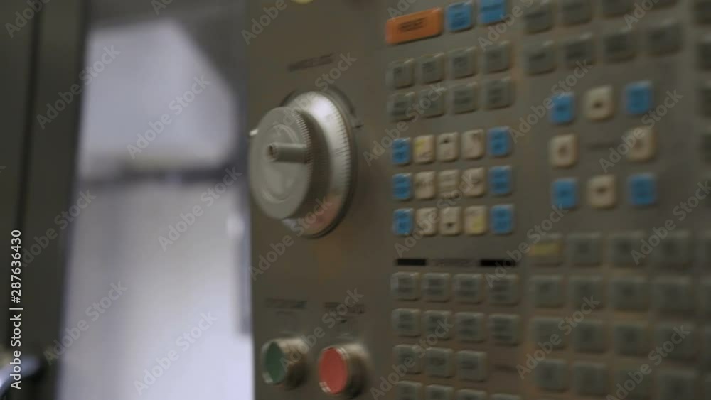 Engineer at the factory starts the injection machine. 4K Engineer at the factory starts the injection machine. 4K